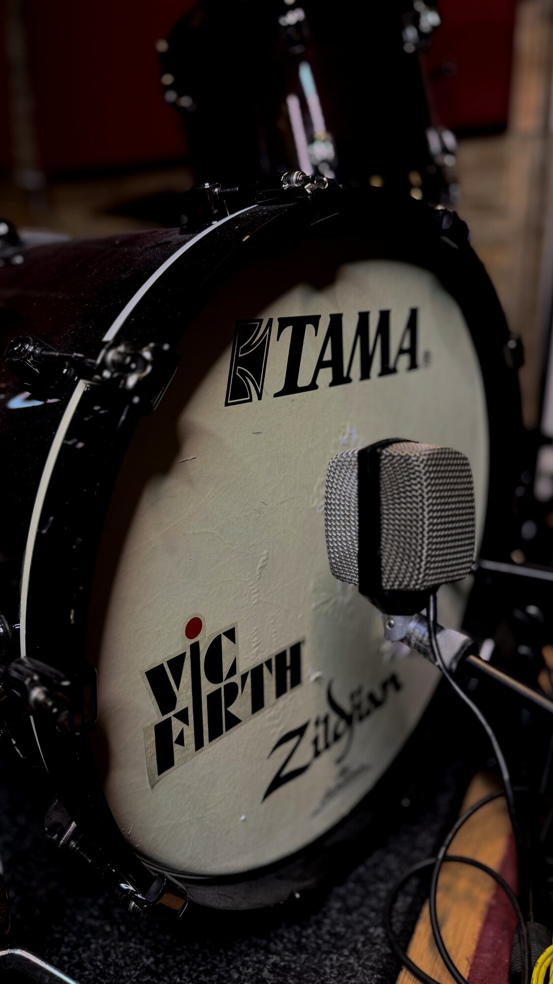 AKG D12 microphone in front of a bass drum